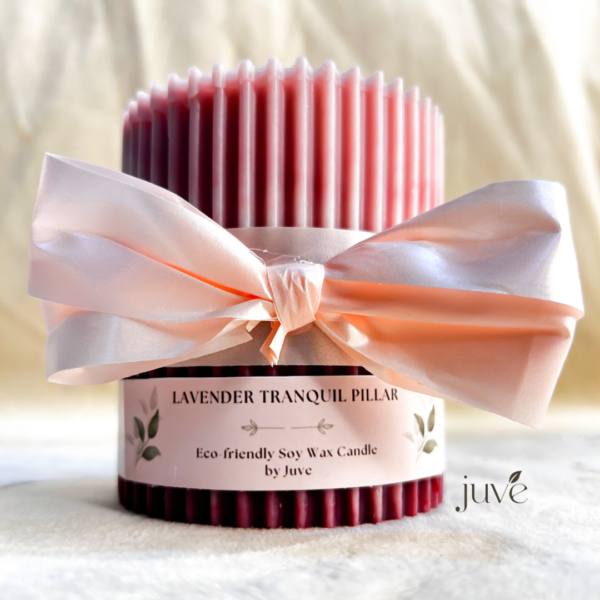 Lavender Tranquil Pillar Candle with a ribbed design and a decorative bow, crafted from eco-friendly soy wax with a calming lavender fragrance.