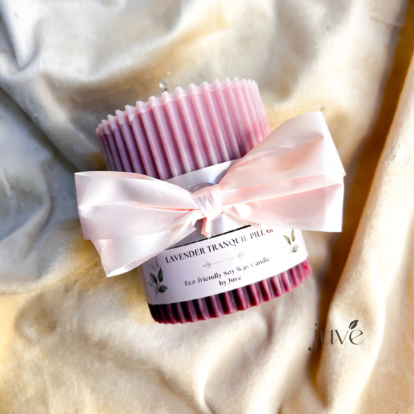 Lavender Tranquil Pillar Candle with a ribbed design and a decorative bow, crafted from eco-friendly soy wax with a calming lavender fragrance.