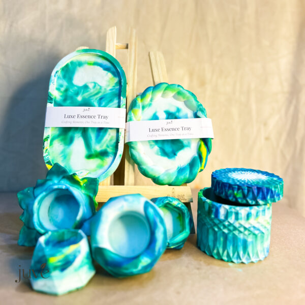 Luxe Essence Tray Special Collection featuring vibrant peacock colors, geometrical candle holders, and a lotus-shaped holder for elegant home decor