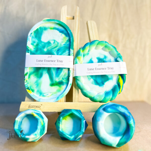 Luxe Essence Tray Special Collection featuring vibrant peacock colors, geometrical candle holders, and a lotus-shaped holder for elegant home decor